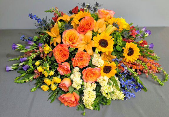 Colorful Tribute Casket Spray from Bakanas Florist & Gifts, flower shop in Marlton, NJ Colorful Tribute Casket Spray from Bakanas Florist & Gifts, flower shop in Marlton, NJ