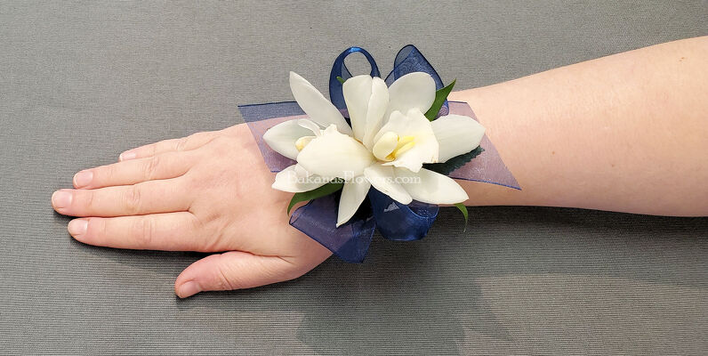 Delicate Mini Cymbidium Wristlet from Bakanas Florist & Gifts, flower shop in Marlton, NJ